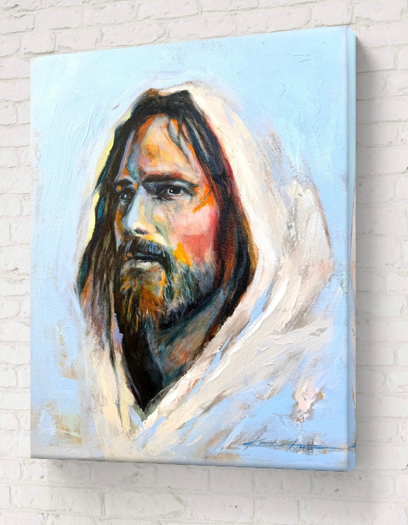 Painting of Jesus with a vibrant blue background and a colorful face representing diversity. Titled The Color of Grace.