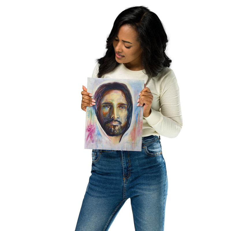 8" x 10" oil painting print of Jesus being held in the hand of a woman displaying the artwork. Vibrant modern Christian Art of Jesus painted in vibrant colors. 